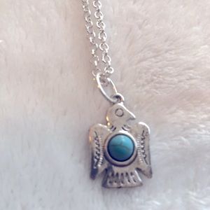 Silver thunderbird necklace with turquoise